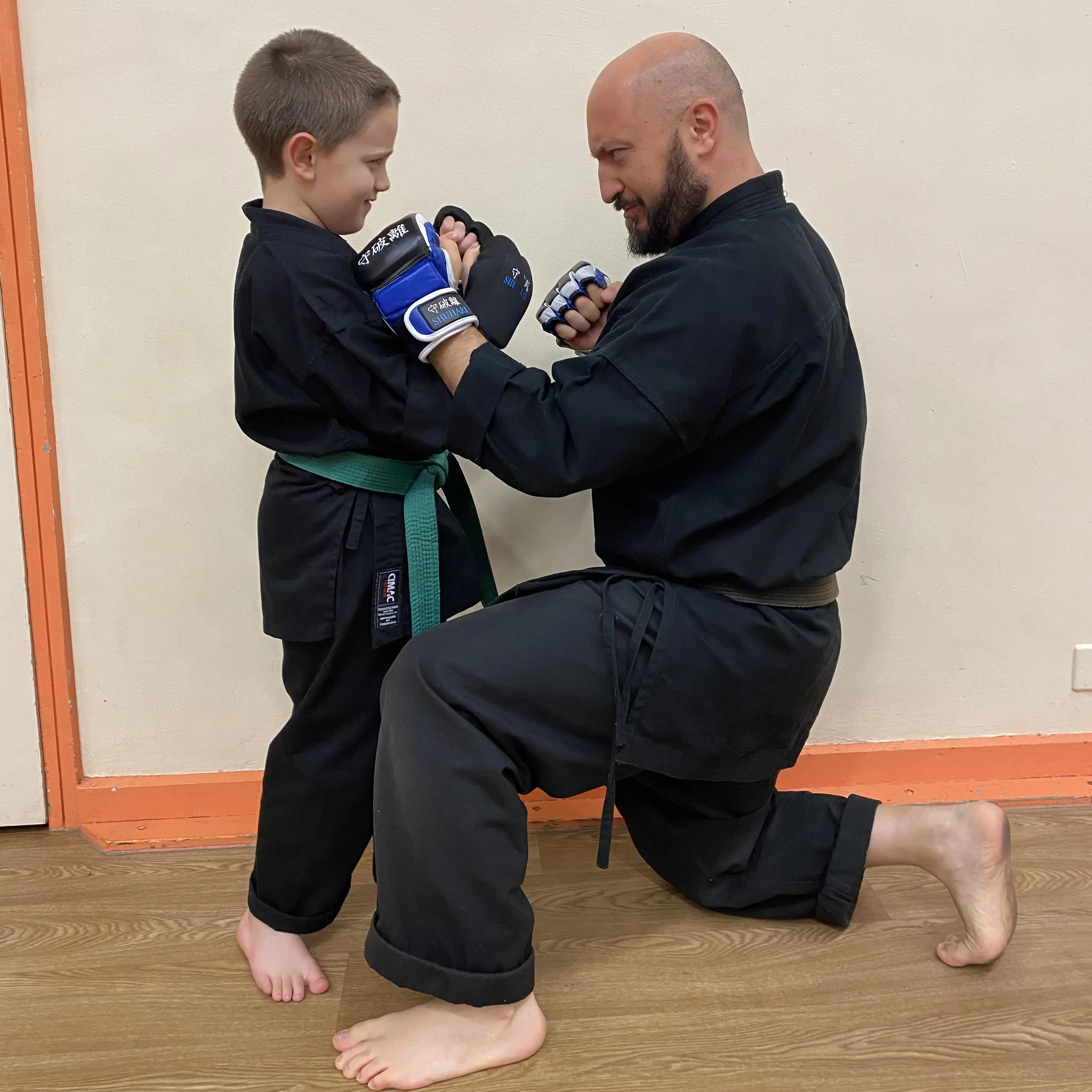 Olgun Tiltay of  Shuhari Self Defence during a very serious staring contest with one of his students in  a martial arts class in Bracknell